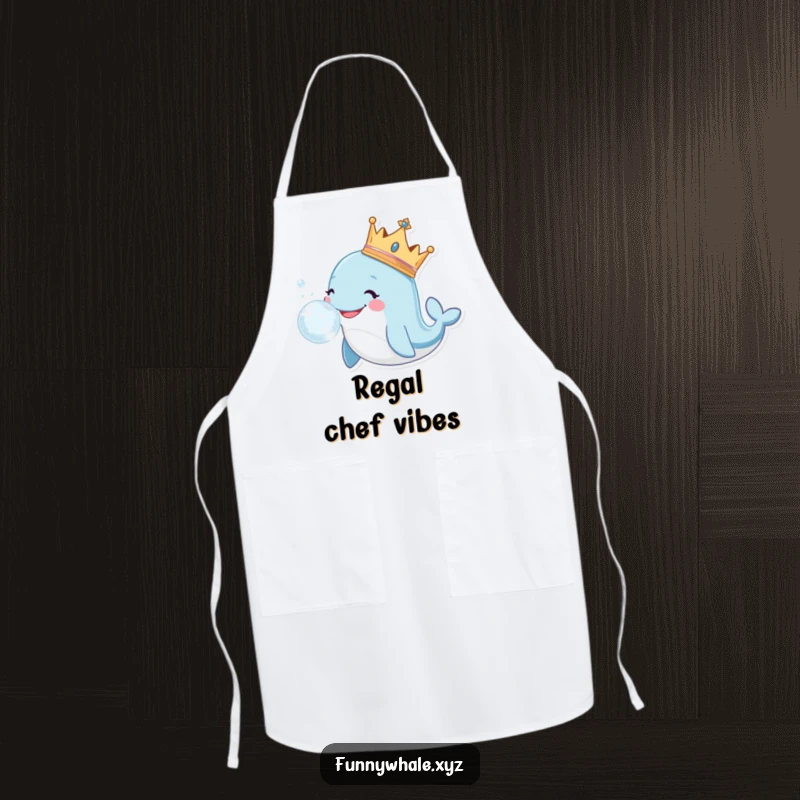 Funny whale wearing a crown blows a large, sparkly bubble on this apron, ready for culinary duties.