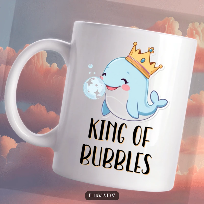 Smiling whale character wearing a golden crown, majestically blowing a large, sparkly bubble on a coffee mug.