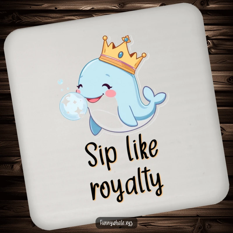 Smiling whale wearing a crown blows a large, sparkly bubble on a coaster, adding regal charm and surface protection.