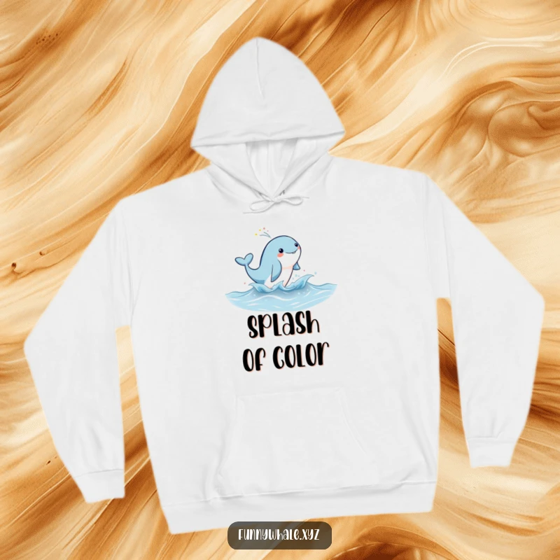 Cute whale character leaping joyfully, surrounded by rainbow mist, featured on a warm and cozy hoodie.
